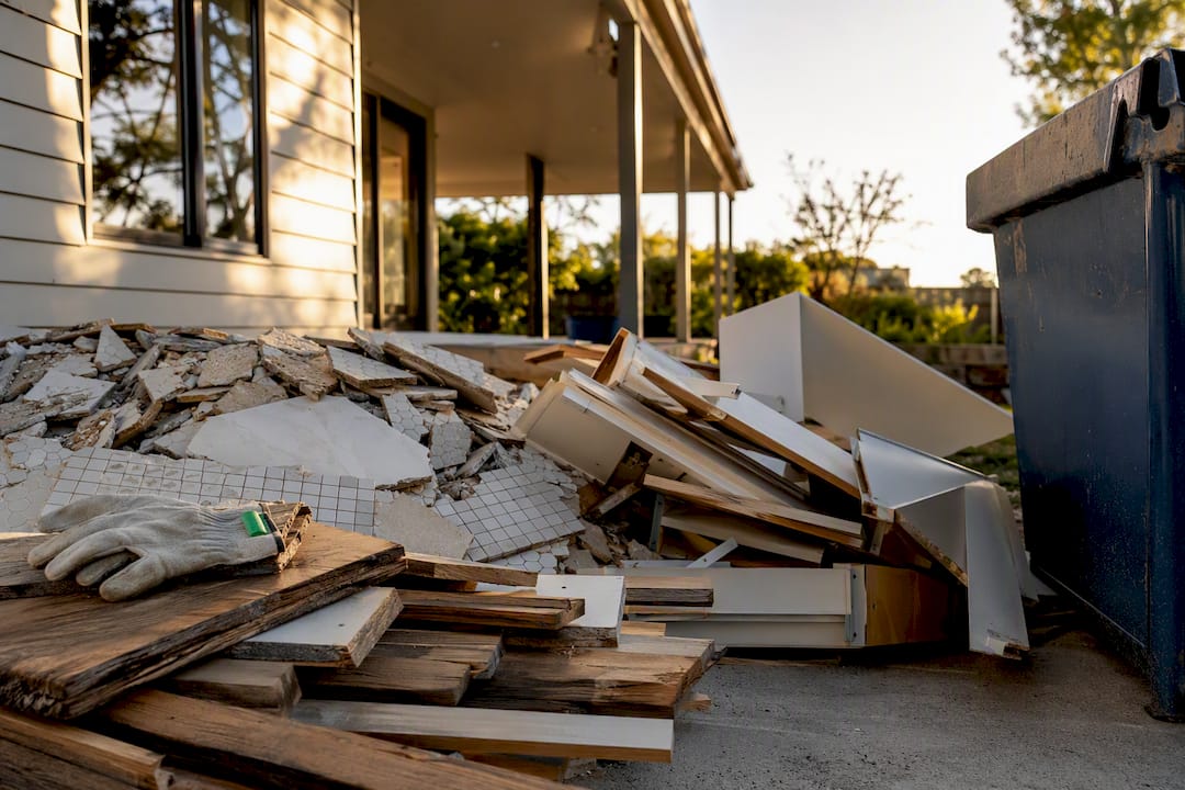 Renovation waste beside an anonymous skip bin